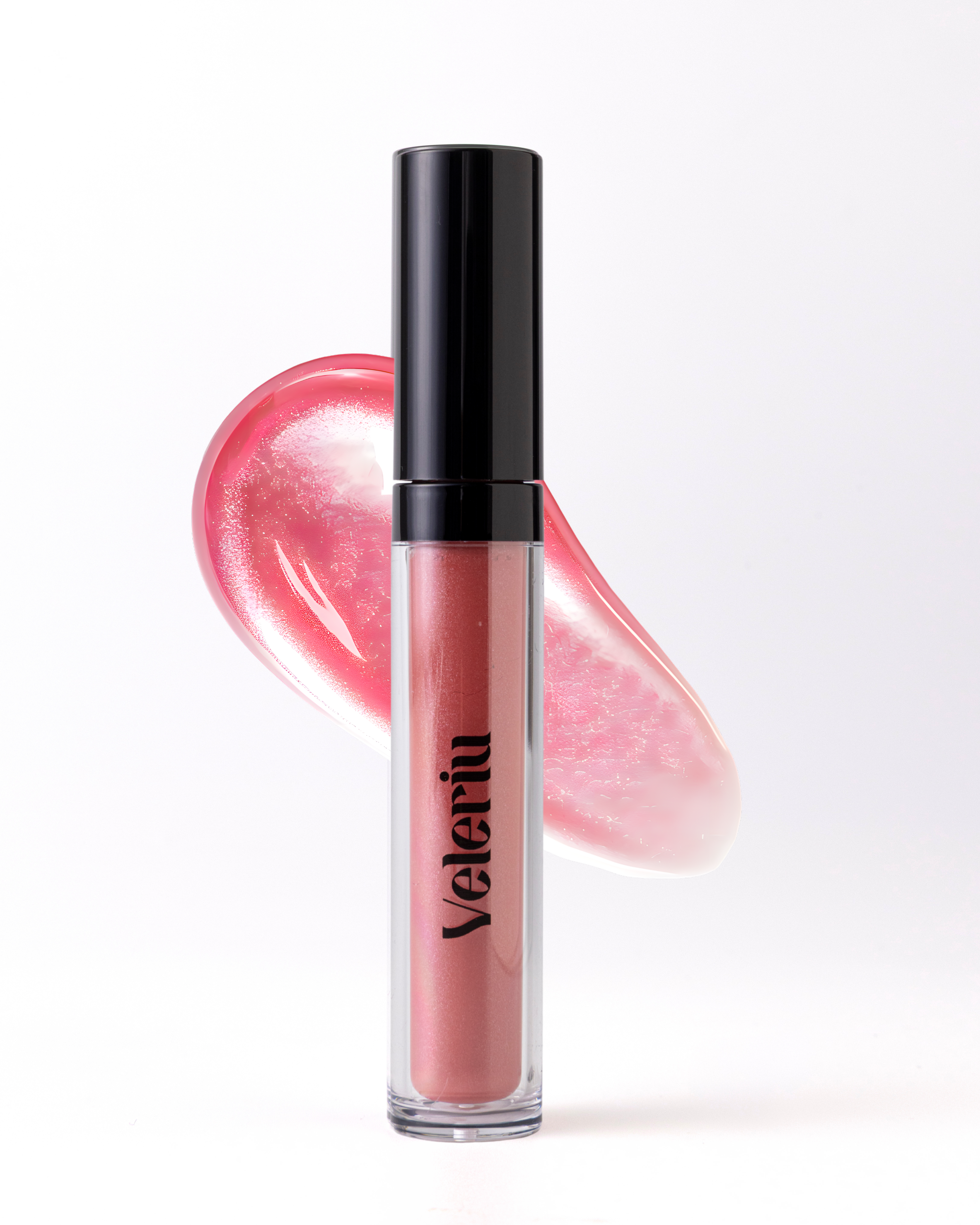Close-up of lips wearing Wonder plumping gloss, a soft neutral rosy pink with cool undertones and a high-shine finish.