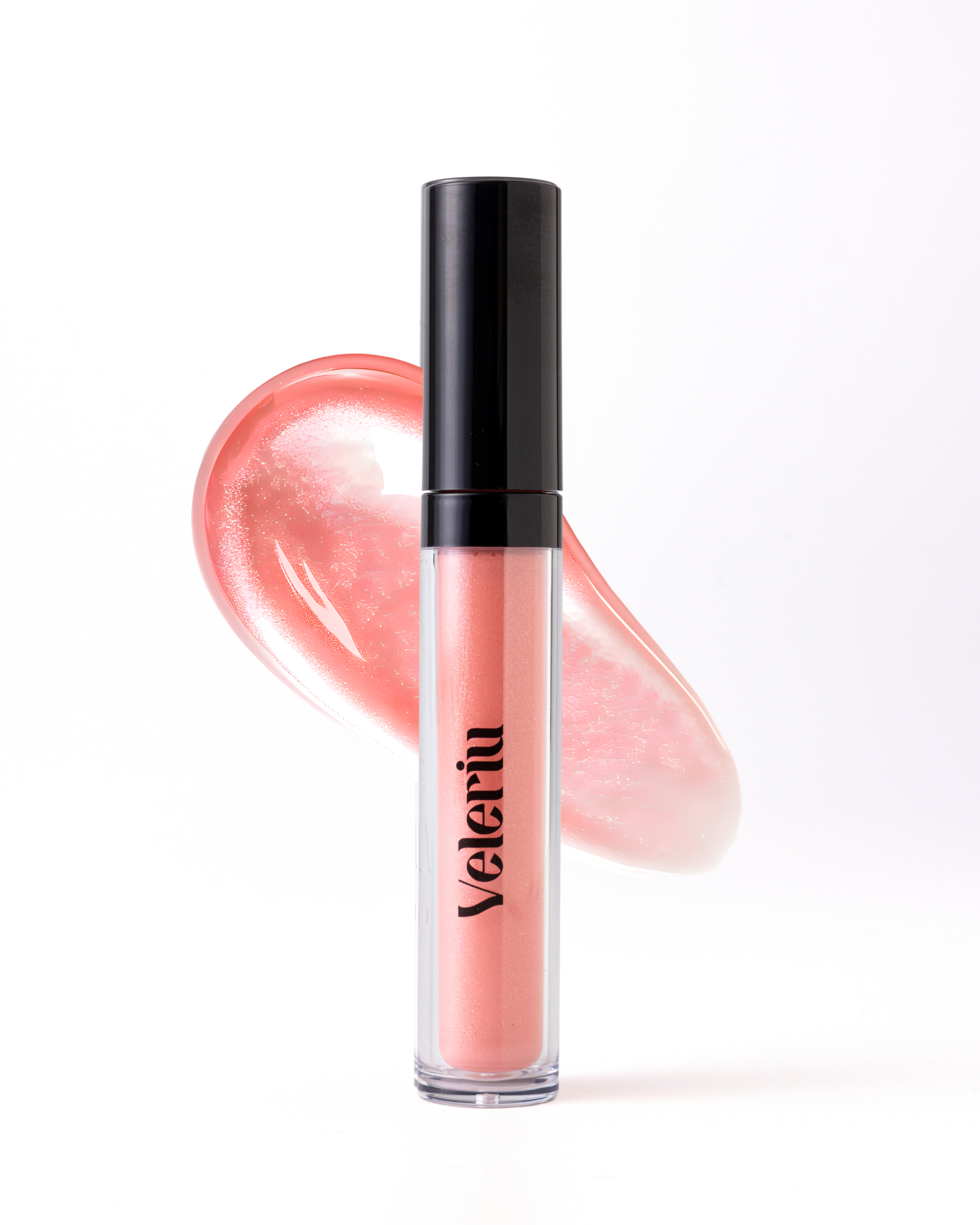 High-shine application of Pixie gloss, a vivid pink with cool blue undertones for a bright, youthful plumping effect.